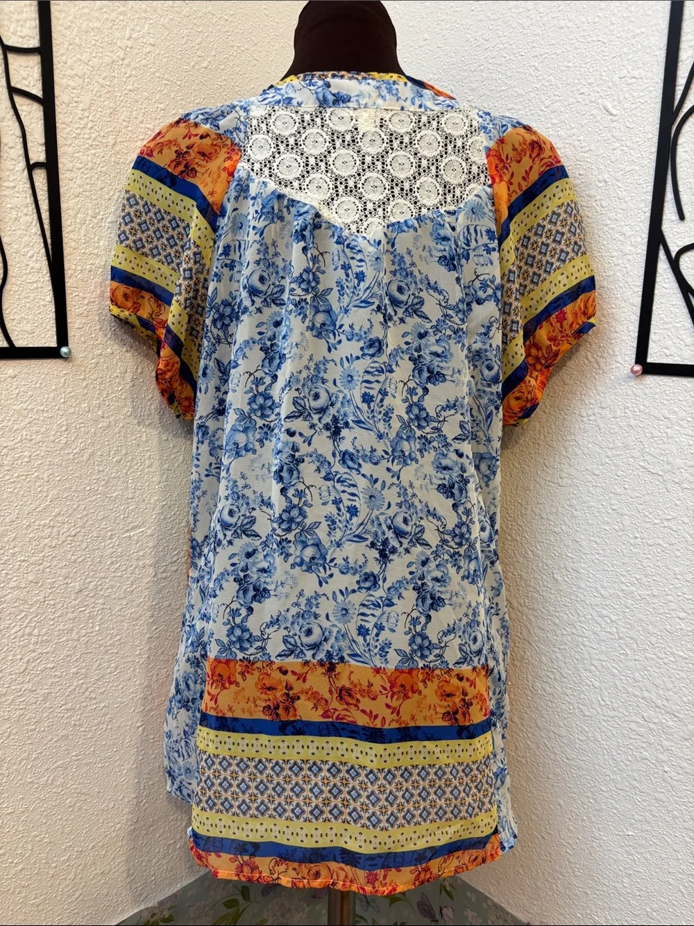 Fig & Flower blue, yellow & orange short sleeve semi-sheer top. Size M.